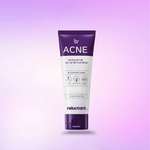 Tube of Acne face wash with 'reluctant.' branding on a gradient purple background
